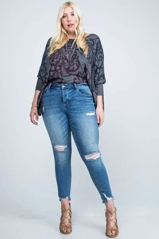 DISTRESSED MID RISE SKINNY WITH DISTRESSED HEM