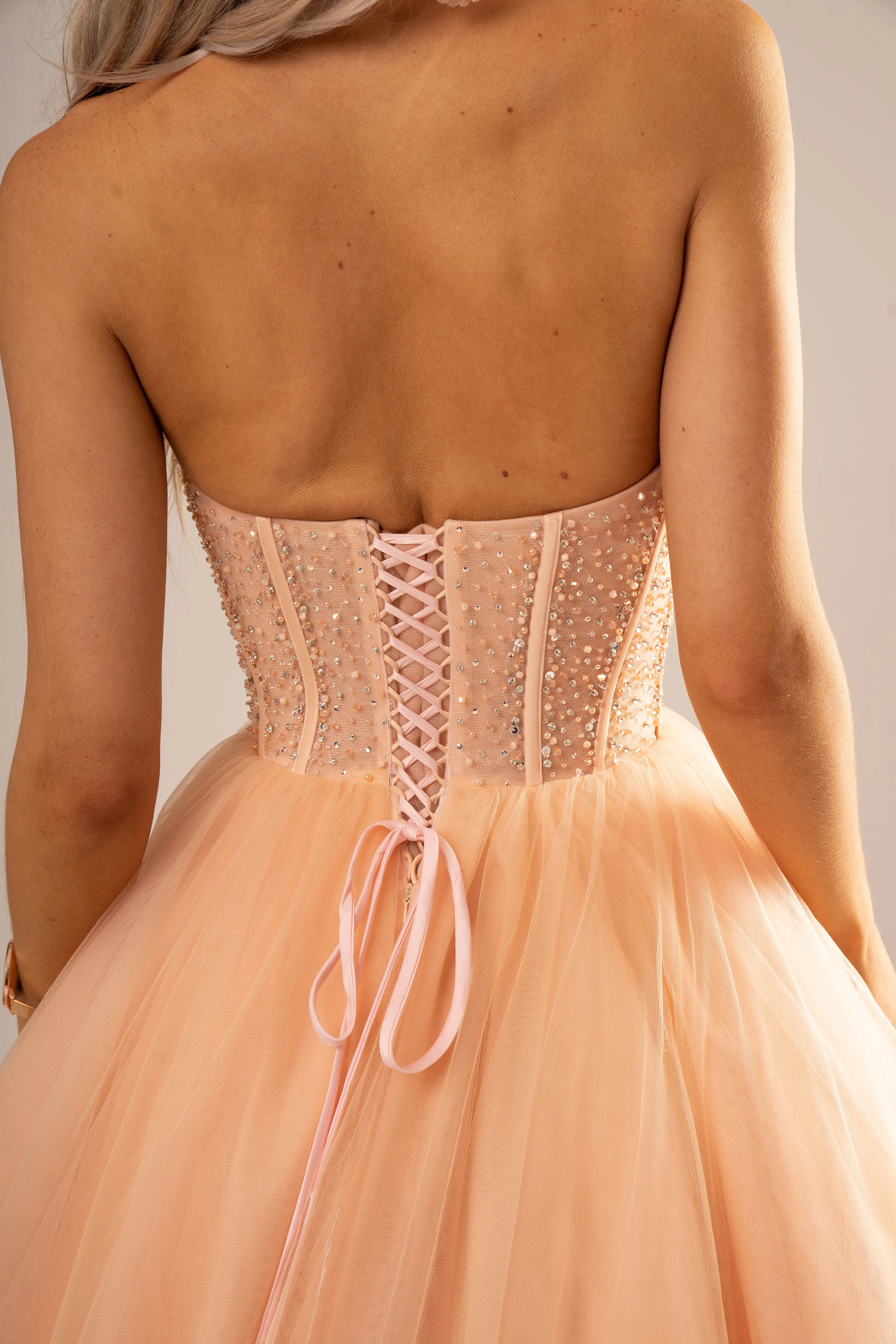 Sparkling peach nude bustier dress for hire